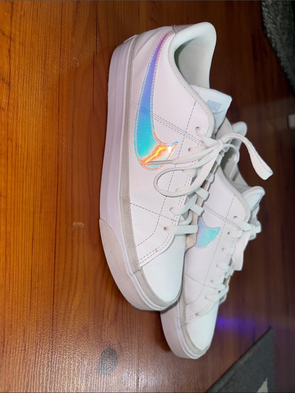 Nike Women's White Sneakers with Iridescent Swoosh Accent